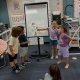 Islands Elementary School Photo #5 - Our Kindergarteners are learning letter sounds by presenting their letter sound knowledge to their classmates.