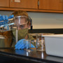 City Academy Photo #4 - Student in Environmental Science prepares a water sample from a local river for testing.