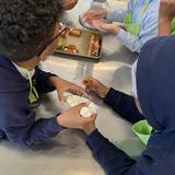 Middle School 35 Stephen Decatur Photo #8 - Students learning how to make cannolis in a cooking class.